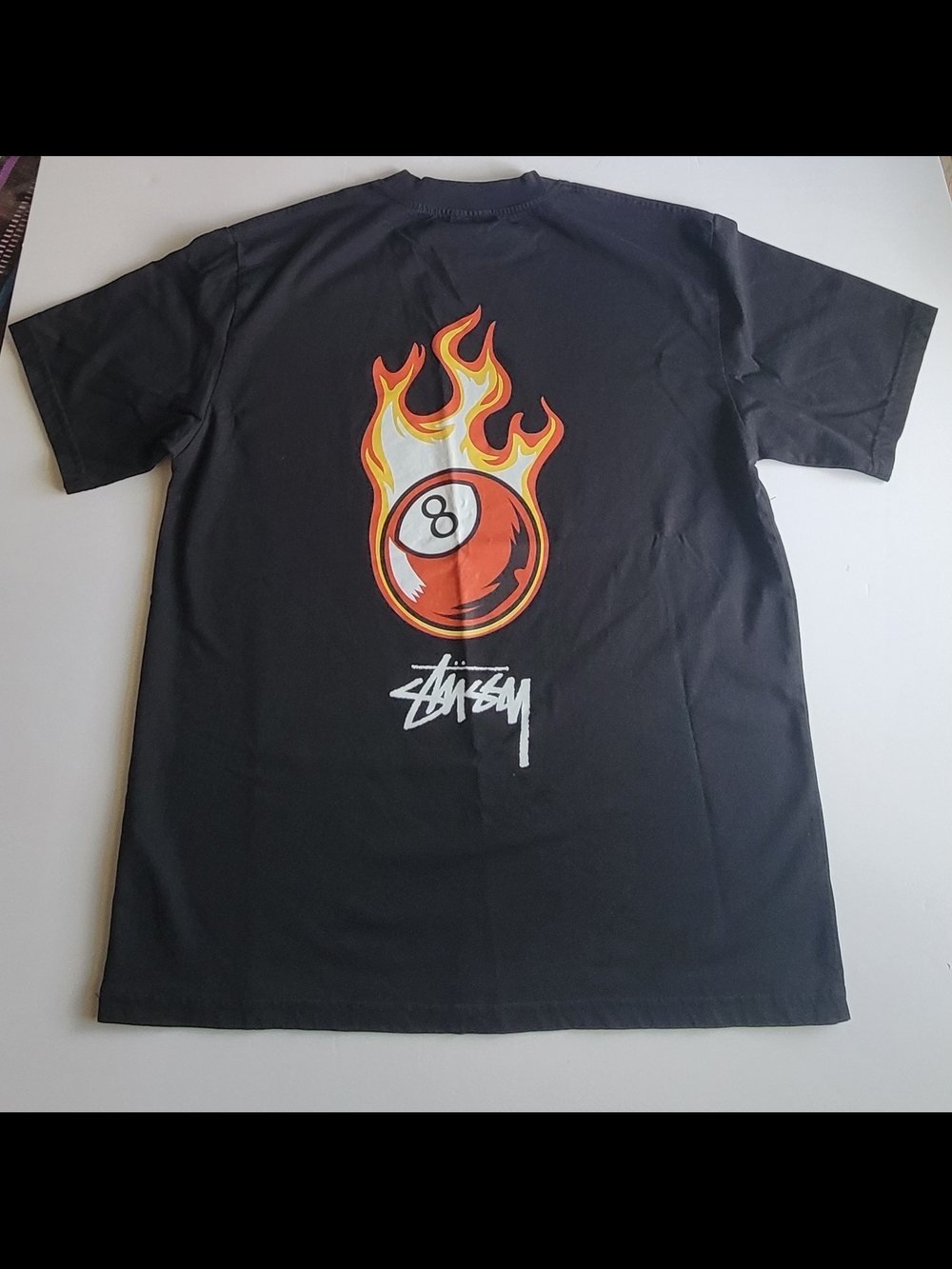 Stussy Black Short Sleeve Tee with Flaming 8-Ball Graphic